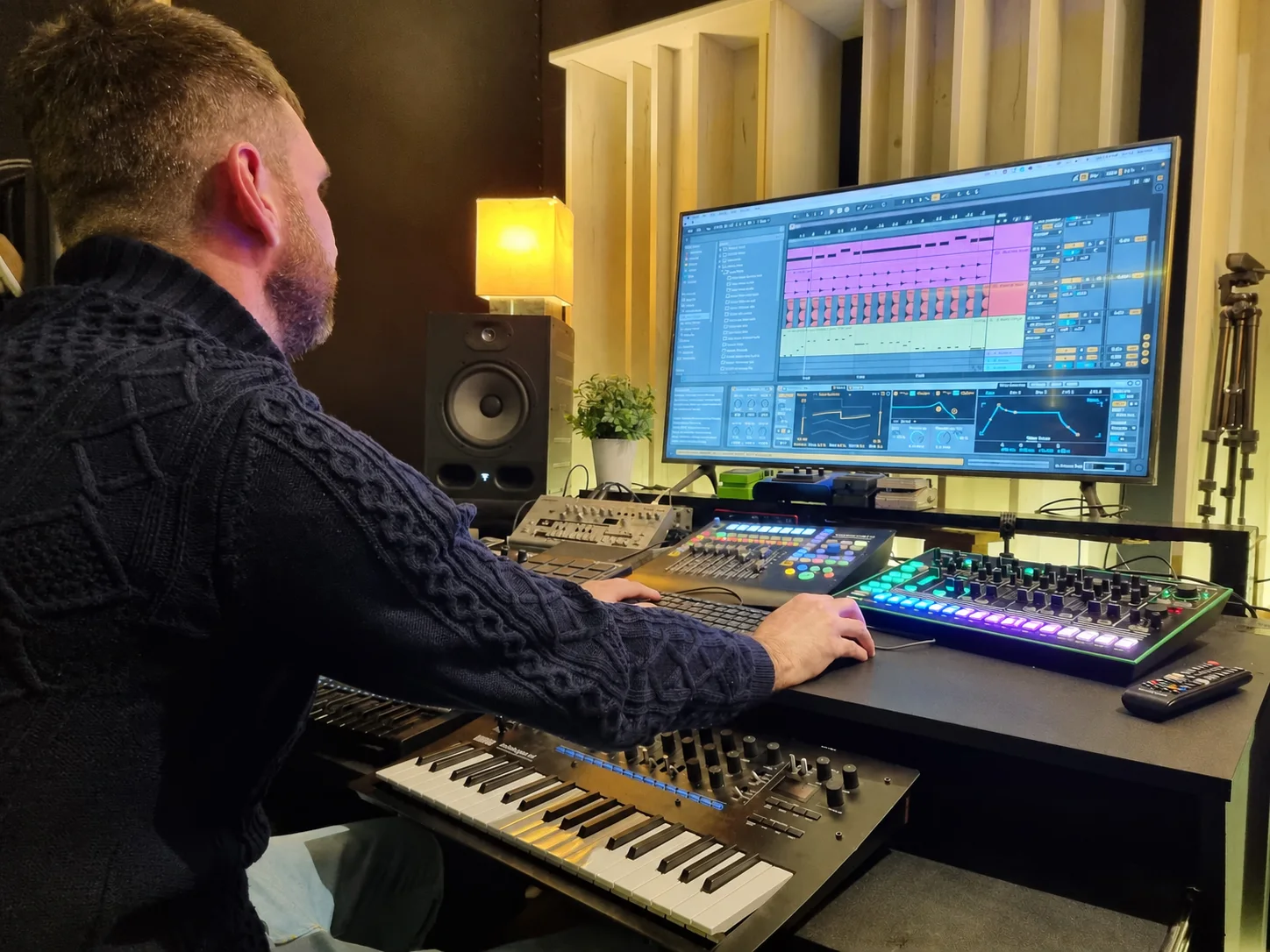 Daniel Williams producing music at a studio workstation